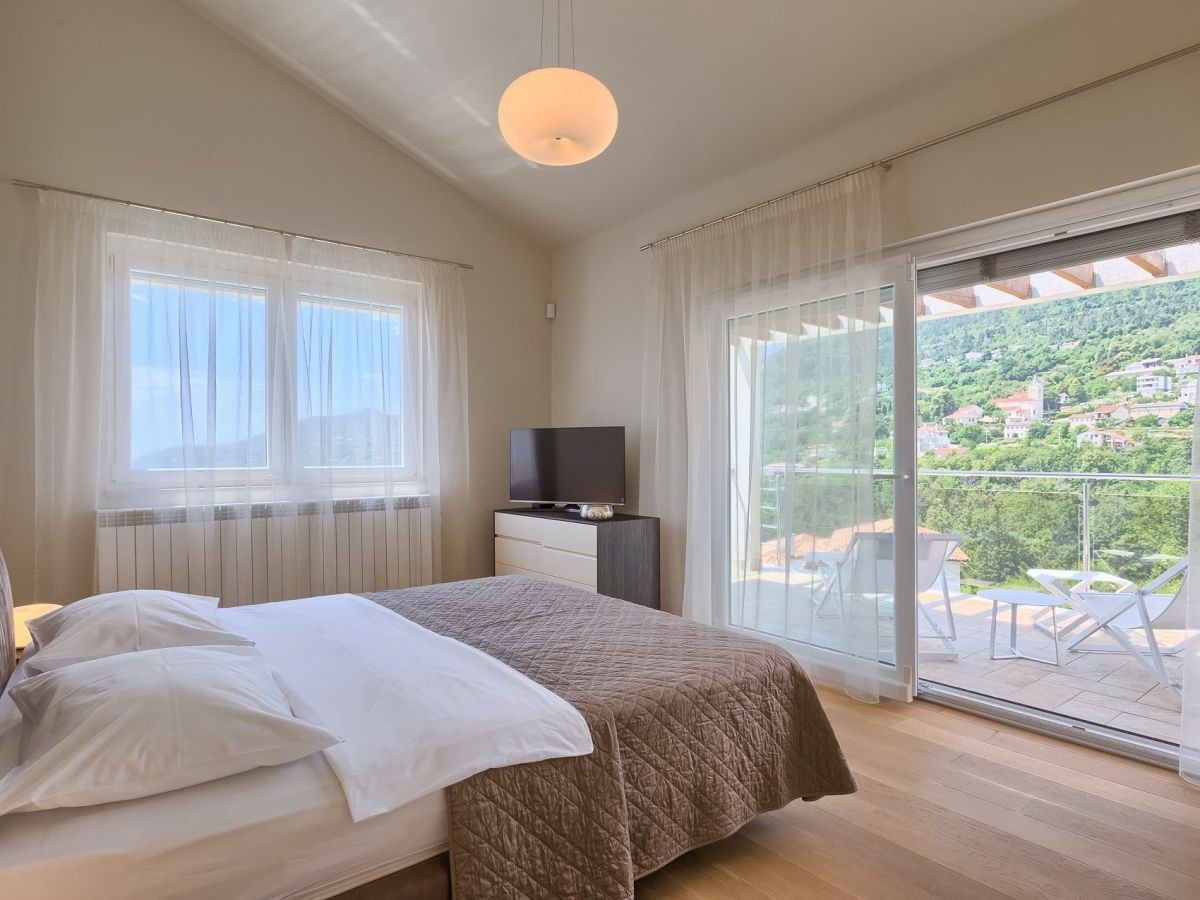 Double bedroom opening to a sea-view terrace
