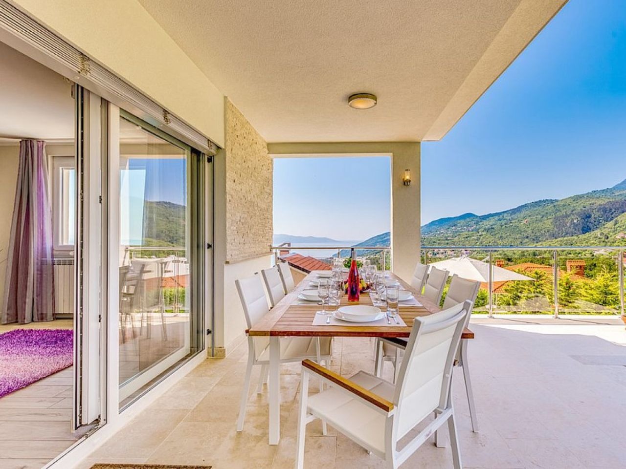Covered dining terrace with panoramic views