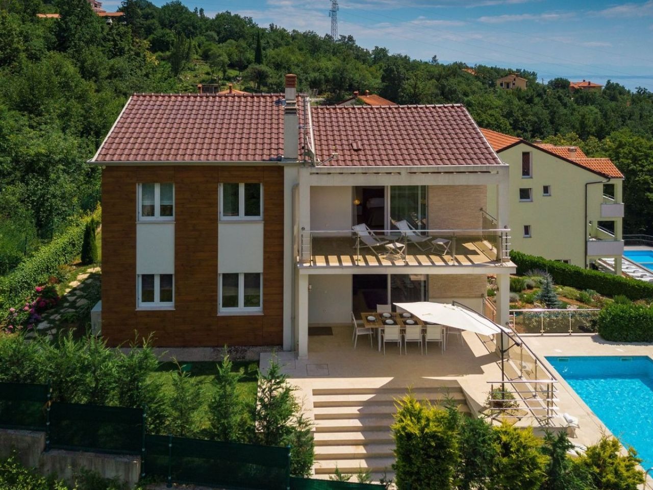Rear facade, terraces, garden and private pool