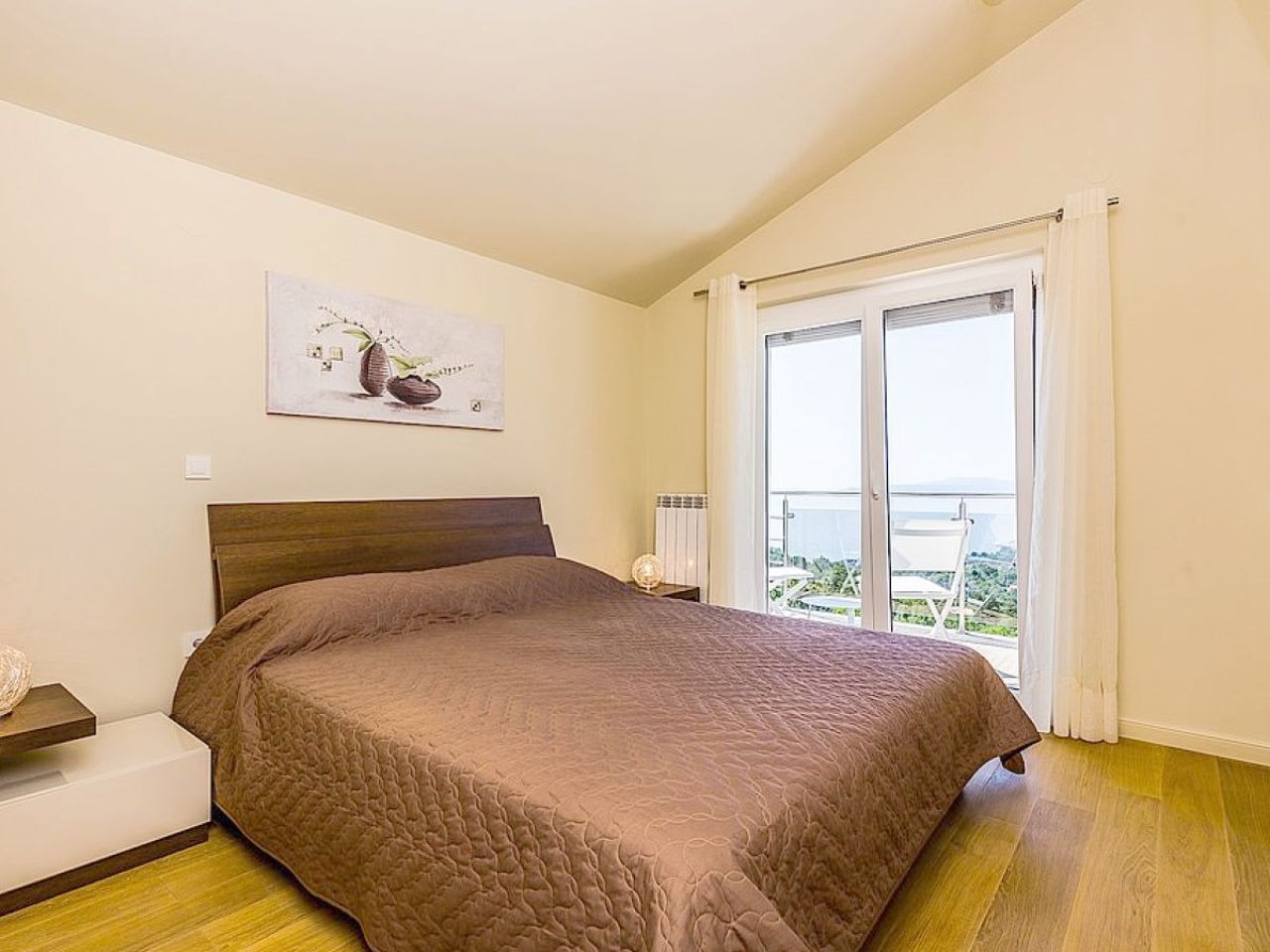 Double bedroom opening to a private sea-view balcony