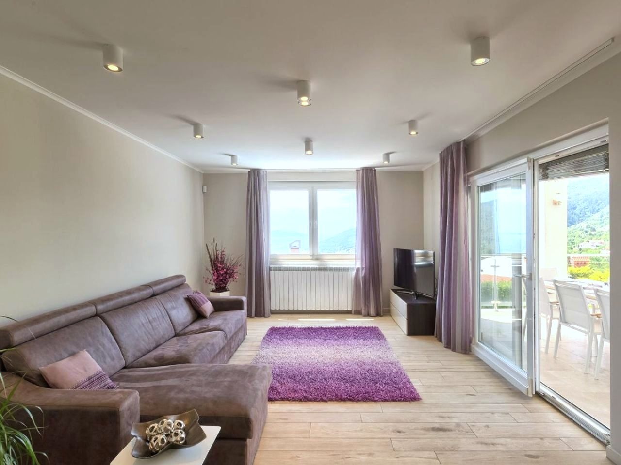 Living room opening to the covered dining terrace