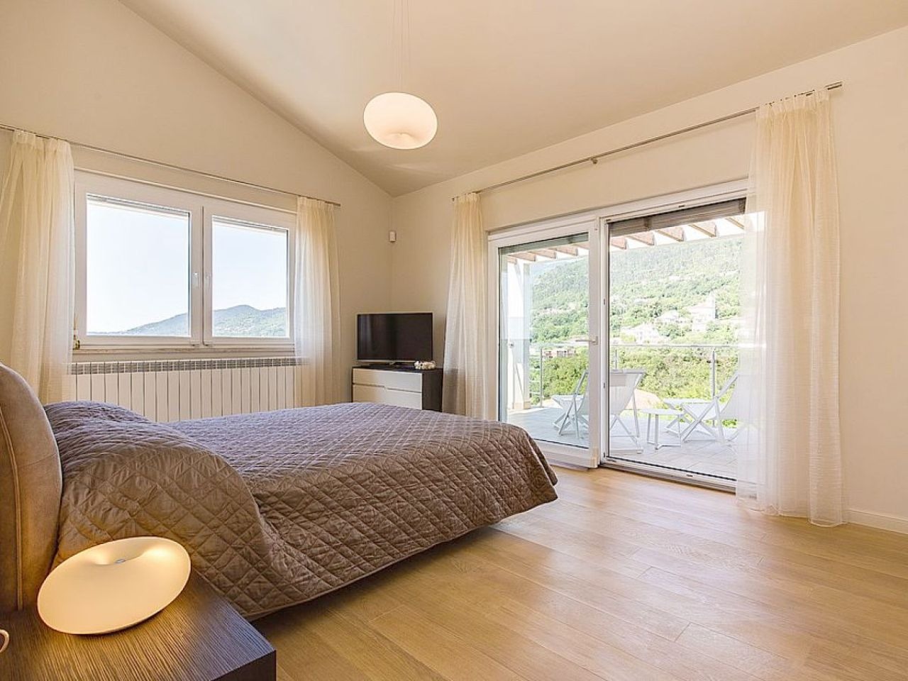 Double bedroom opening to a balcony