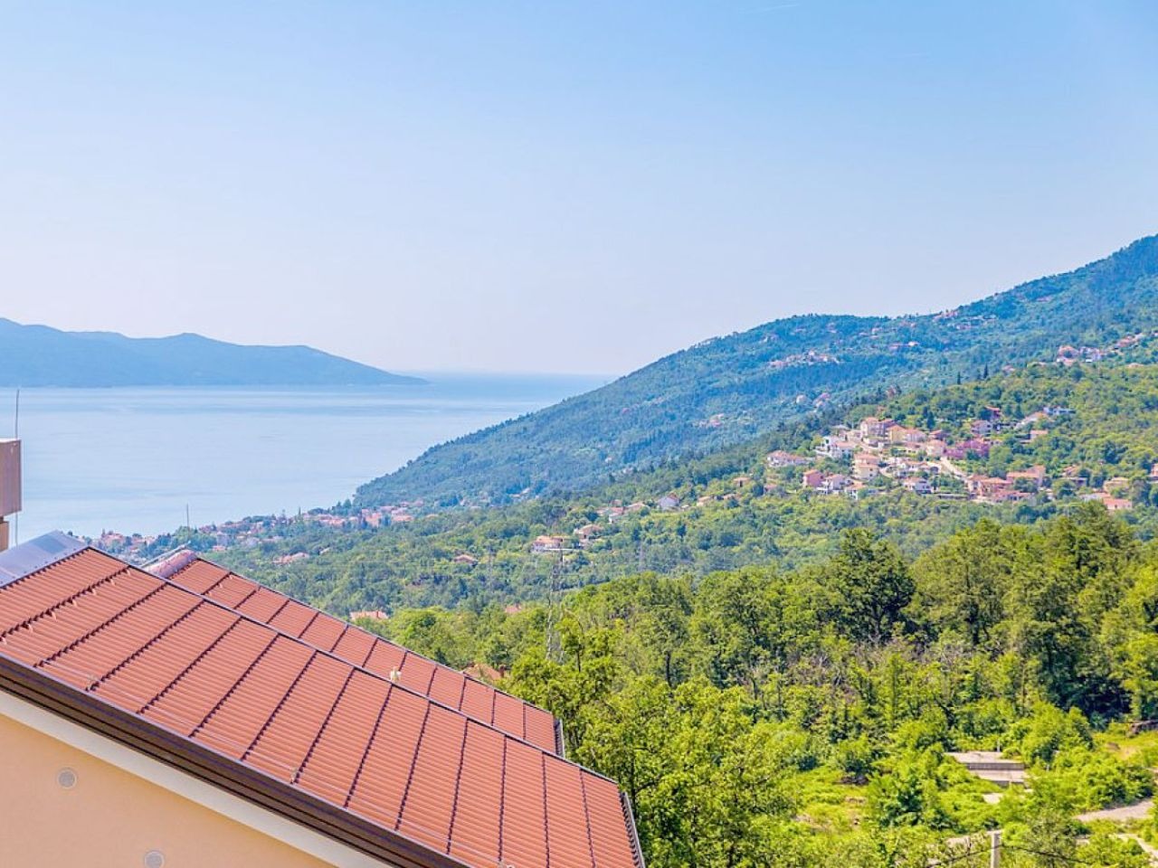 Panoramic view across Kvarner Bay and the wooded hillside