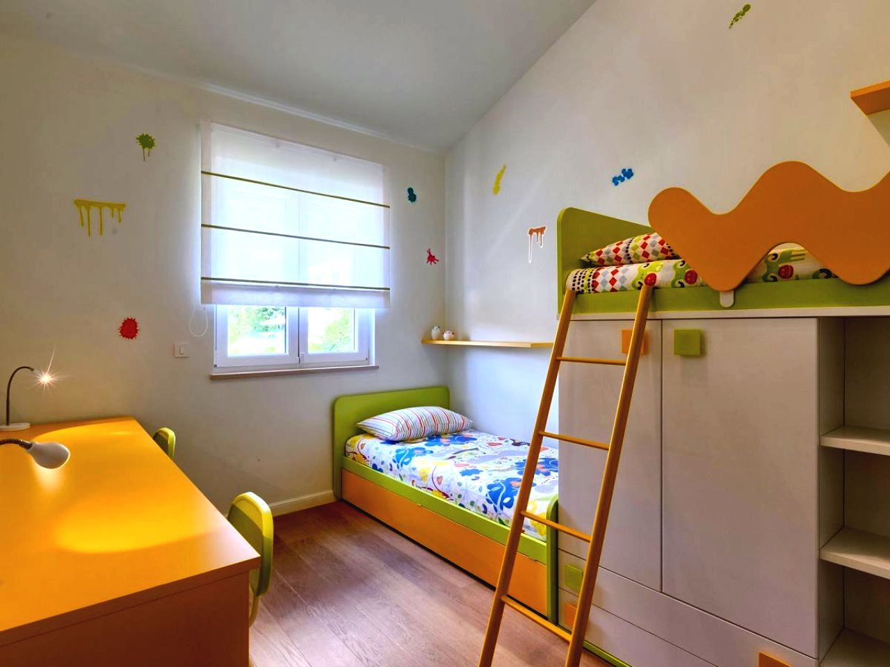 Colourful children’s bedroom with bunk bed, single bed and desk