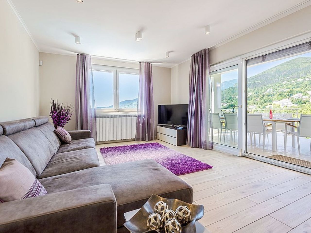 Living room opening to the covered terrace